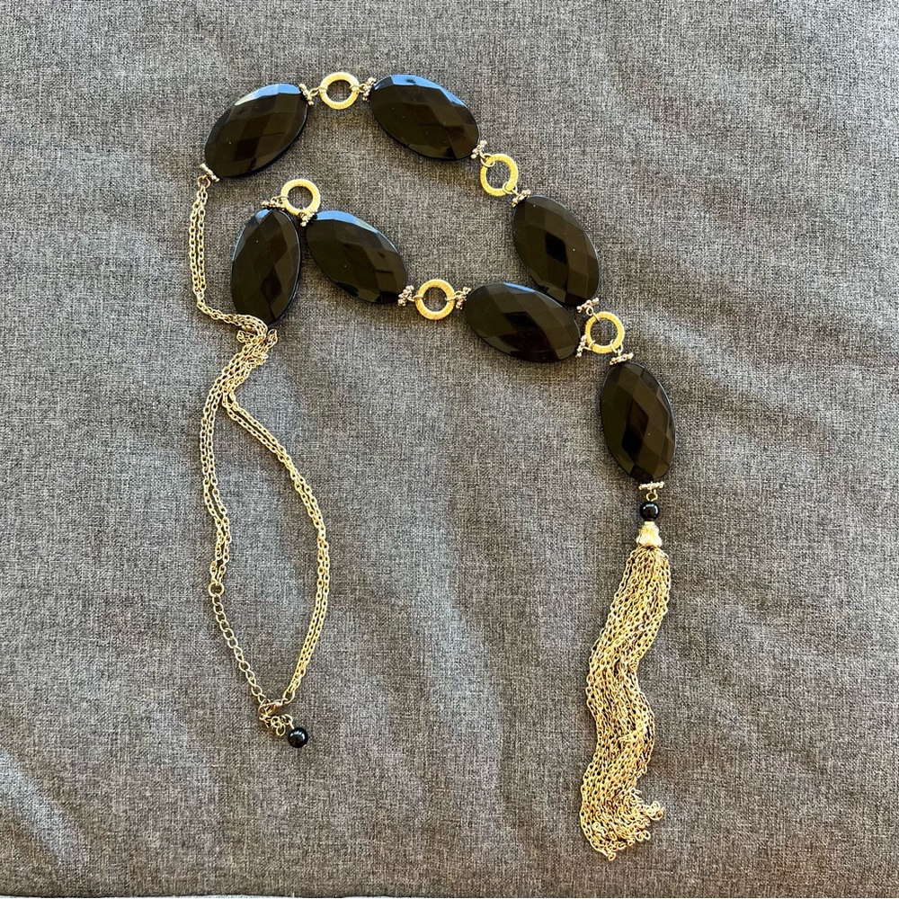 Gold tone black acrylic glass bead station necklace with a tassel 31”